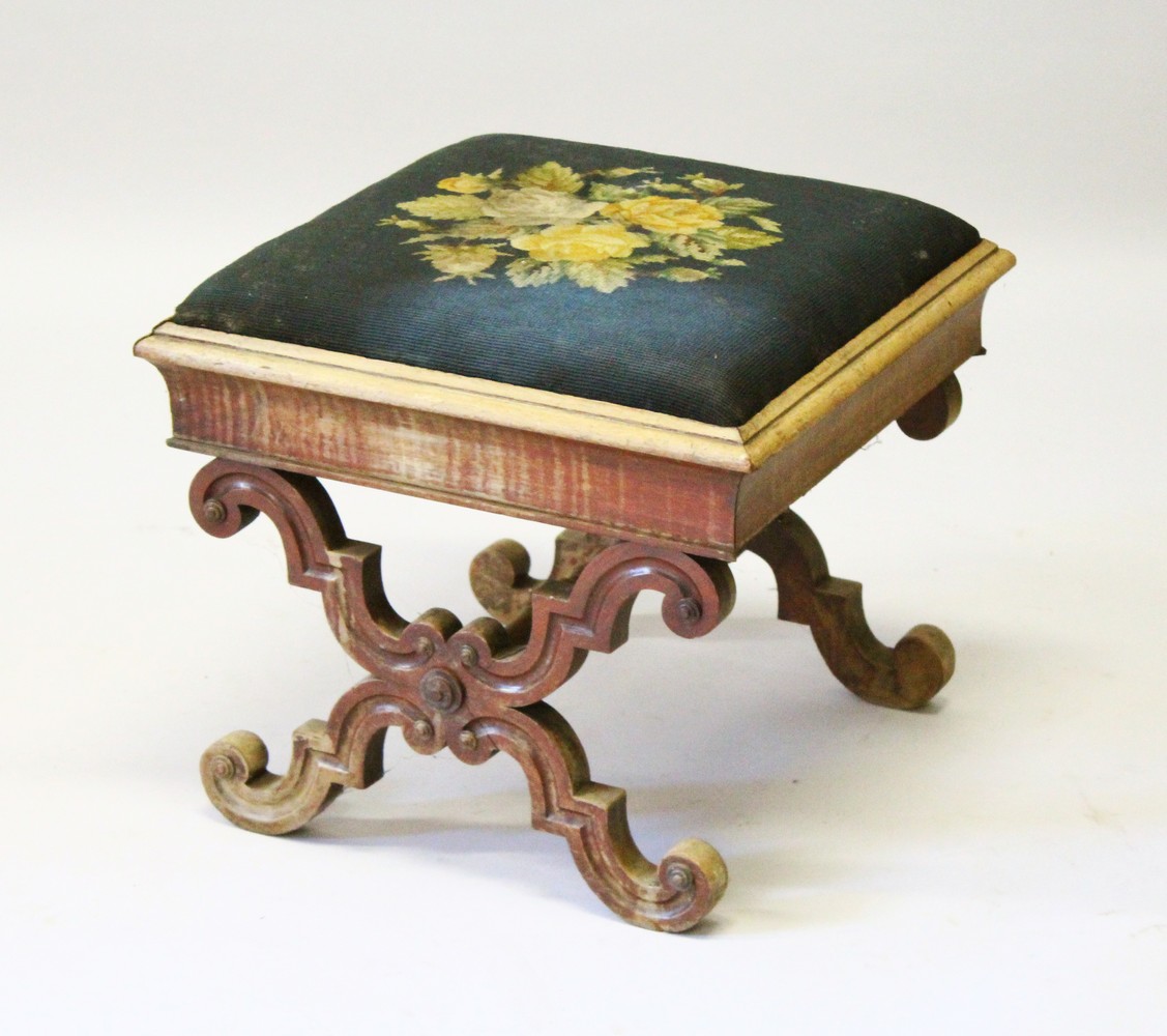 A VICTORIAN MAHOGANY CROSS FRAME STOOL with needlework top. 51cms.