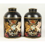 A PAIR OF DECORATIVE "TEA CANISTERS". 37cms high.