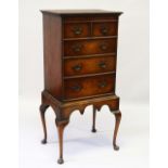 A GOOD 1920'S WALNUT CHEST ON STAND, with two short and three long drawers on a stand with