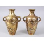 A SMALL PAIR OF 19TH CENTURY CHINESE POLISHED BRONZE VASES, with leaves in relief. 16cms high.