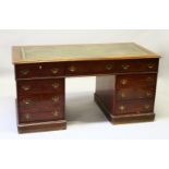 A VICTORIAN GEORGIAN STYLE MAHOGANY PEDESTAL DESK, the top with leather writing panel, three