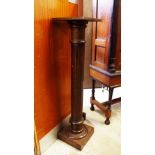 A MAHOGANY TORCHERE WITH SQUARE TOP, fluted column support on a square base.