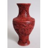 A CINNABAR RED LACQUER VASE. 25cms high.