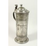 A 17TH CENTURY PEWTER LIDDED TANKARD, stamped date 1665, the sides engraved with classical