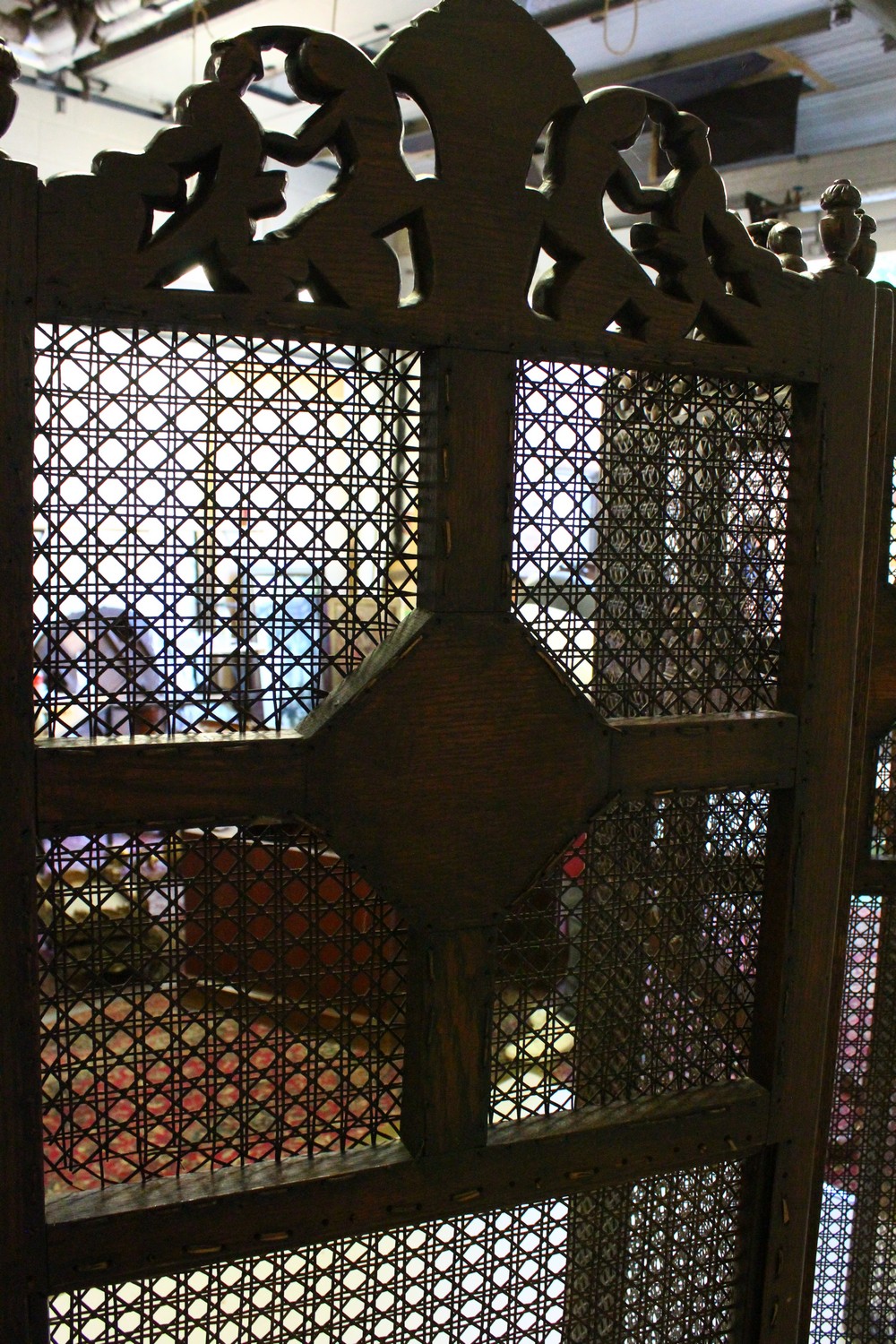 A LARGE BERGERE OAK FOUR FOLD SCREEN, the top carved with cupids and scrolls. 244cms wide overall - Image 8 of 10