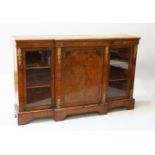 A VICTORIAN INLAID FIGURED WALNUT CREDENZA, with central panel door flanked by panel doors, ormolu