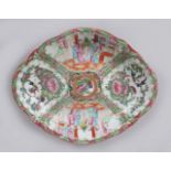 A GOOD CANTON CHINESE SHAPED OVAL DISH, painted with birds, flowers and figures. 26cms long.