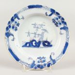 AN 18TH CENTURY TIN GLAZE BLUE AND WHITE PLATE, POSSIBLY IRISH, with Chinese design. 23cms