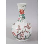 A CHINESE FAMILLE ROSE MOTTLED VASE, with flowers. 22cms high. Six character mark.