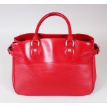 A LOUIS VUITTON RED LEATHER HANDBAG, in outer bag.