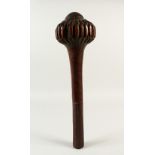 A GOOD 19TH CENTURY FIJIAN CLUB, with carved bulbous head and geometric carved hand grip. 44cms