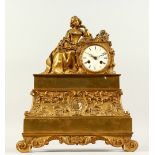 A 19TH CENTURY FRENCH ORMOLU MANTLE CLOCK, mounted with a seated female figure reading a book, on