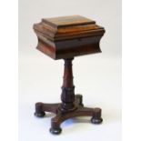A VICTORIAN ROSEWOOD TEAPOY with fitted interior, on a turned column support and shaped platform