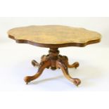 A GOOD VICTORIAN FIGURED WALNUT SHAPED TOP LOO TABLE with turned column support ending in four