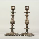 A PAIR OF PLATED CANDLESTICKS. 30cms high.