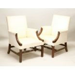 A GOOD PAIR OF CHIPPENDALE DESIGN GAINSBOROUGH CHAIRS, with padded backs, arms and seats, the show