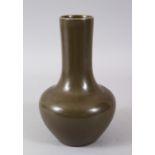 A TEA DUST GLAZE BOTTLE VASE. 22cms high.