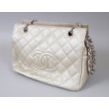 A VERY GOOD CHANEL SILVERY GOLD BAG, with chrome and leather entwined handle, in outer bag.