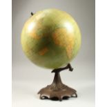 A HAMMETT & CO 12-INCH GLOBE, on a cast metal stand.