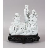 A GOOD 18TH/19TH CENTURY CHINESE BLANC DE CHINE PORCELAIN FIGURE OF THREE LADIES, playing