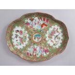 A GOOD CANTON CHINESE SHAPED OVAL DISH, painted with panels of birds, flowers, butterflies and