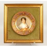 A VIENNA CIRCULAR PORCELAIN PLATE, painted head and shoulder of a pretty young lady, within a superb