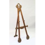 A GOOD FRENCH WALNUT PICTURE EASEL. 159cms high.