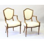 A GOOD PAIR OF FRENCH HEPPLEWHITE STYLE BEECH ARMCHAIRS, with shield shape backs, padded seats and