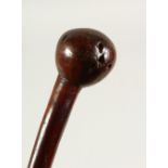 A RUSTIC WOODEN WALKING CANE. 89cms long.