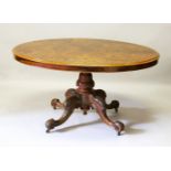 A GOOD VICTORIAN FIGURED WALNUT OVAL LOO TABLE, with quartered top, central column, on quadruple