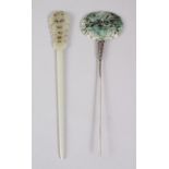 TWO CARVED JADE HAIRPINS. 17cms long.