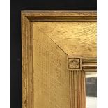 Early 20th Century English School. A Gilt Composition Frame, with Sunrise Motifs, inset Mirror