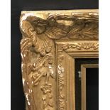 20th Century French School. A Carved Giltwood Frame, with Swept and Pierced Centres and Corners,