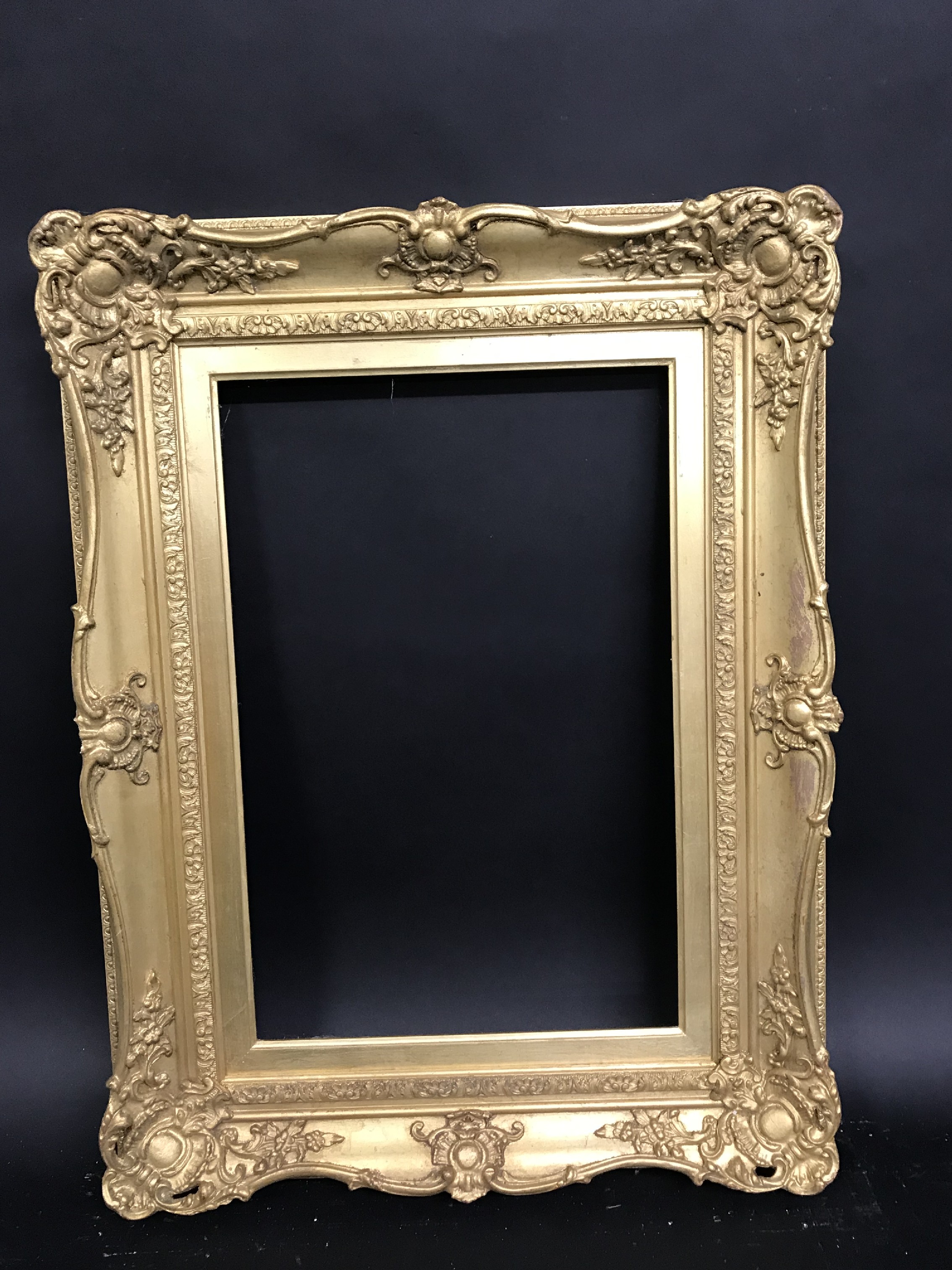 20th Century English School. A Gilt Composition Frame, with Swept Centres and Corners, 18" x 12" ( - Image 2 of 3