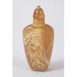 A 19TH CENTURY CHINESE RHINOCEROS HORN SNUFF BOTTLE, the front carved in relief to depict a figure