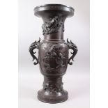A JAPANESE MEIJI PERIOD BRONZE ONLAID TWIN HANDLED VASE, the tapering vase with central panels of on