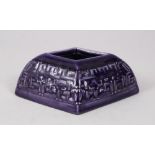 A GOOD CHINESE AUBERGINE GROUND DIAMOND SHAPED PORCELAIN BRUSH WASHER, with moulded decoration of