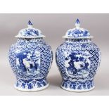 A PAIR OF 19TH CENTURY CHINESE BLUE & WHITE PORCELAIN GINGER JARS & COVERS, the body of the jars