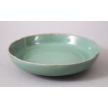 A CHINESE CELADON RU WARE PORCELAIN DISH, 16.5cm diameter.