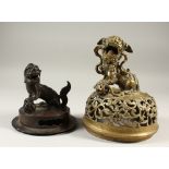 A CHINESE MING DYNASTY BRONZE KORO COVER OF LION DOG & BALL, with another bronze koro cover in the