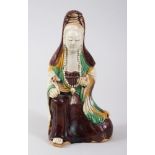 A CHINESE 19TH CENTURY SANCAI / FAMILLE VERTE PORCELAIN FIGURE OF GUANYIN, 19.5cm high x 10 cm