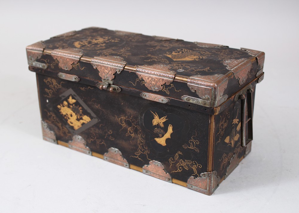 A JAPANESE LATE MEIJI PERIOD LACQUER LIDDED BOX, with a hinged lid, metal mounts, and decorated with