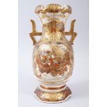 A JAPANESE LATE MEIJI / TAISHO PERIOD TWIN HANDLE SATSUMA VASE, the body with gilded decoration of