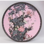 A LARGE JAPANESE MEIJI PERIOD PINK GROUND CLOISONNE CHARGER, decorated upon its pink ground to