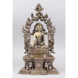 A GOOD SINO TIBETAN BRONZE BUDDHA / DEITY, seated upon a fitted bronze base and surround, the