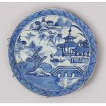 AN 18TH CENTURY CHINESE BLUE & WHITE PORCELAIN CHARGER SECTION, the dish depicting scenes of