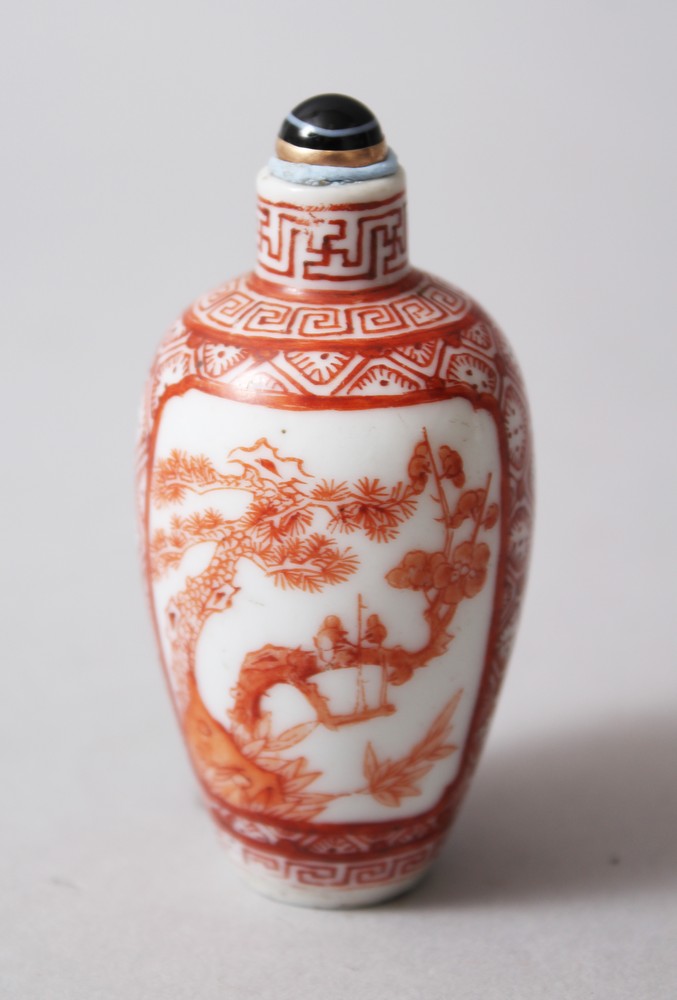 AN 18TH CENTURY CHINESE IRON RED PORCELAIN SNUFF BOTTLE, decorated in iron red to depict two
