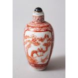 AN 18TH CENTURY CHINESE IRON RED PORCELAIN SNUFF BOTTLE, decorated in iron red to depict two