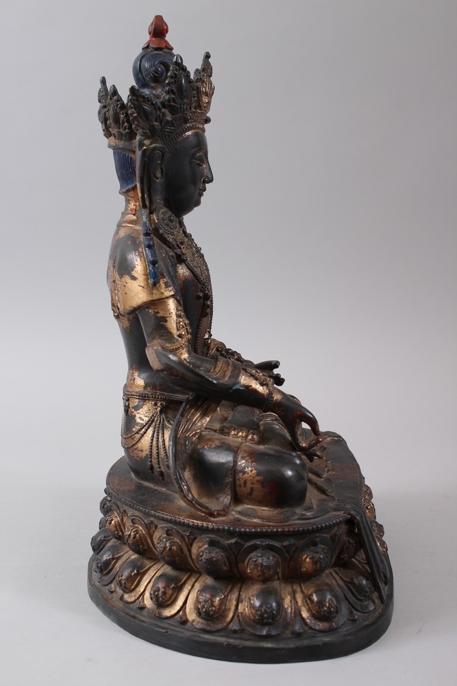 A CHINESE GILT BRONZE FIGURE OF A BUDDHA, seated upon a lotus formed base in a meditating position, - Image 3 of 7