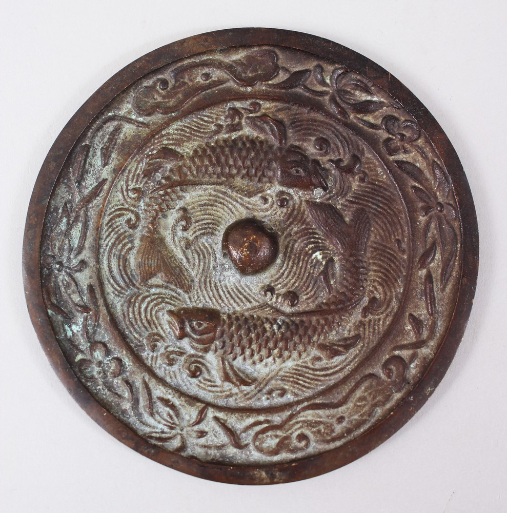 A GOOD CHINESE BRONZE TANG STYLE MIRROR WITH KOI CARP , the mirror with twin swimming koi carp